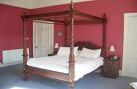 Property Photo: The four poster bed in the master bedroom