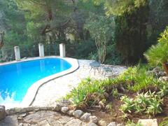 Property Photo: pool area, surrounded by garden