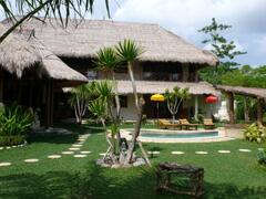 Property Photo: Luxurious Bali Villa Vacation Home Rental â€“ Rumah Santai with a water slide pool.