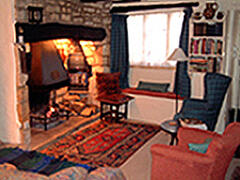 Property Photo: Living room with inglenook fire
