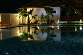 Property Photo: Pool area by night
