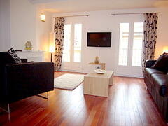 Property Photo: Two small Juliette Balconies a modern open sitting room overlooking Place Rossetti.