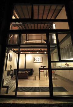 Property Photo: Atelier, above: sleeping loft/bath, below: living/dining/kitchen area