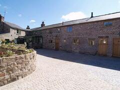 Property Photo: The Shippon Barn with courtyard parking. Private enclosed lawned garden to rear.