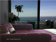 Property Photo: Bedroom with sea view balcony
