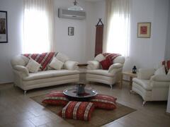 Property Photo: Ottoman Style Lounge Room