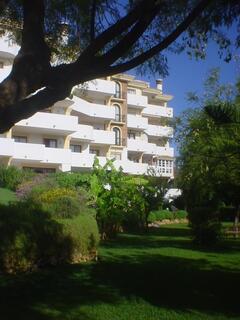 Property Photo: View of apartment from the large, peaceful gardens