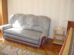 Property Photo: Kiev apartment luxury studio prorizna street leather cocach living room
