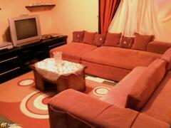 Property Photo: Living room with corner couch L â€“ shaped. It has all means of entertainment.