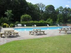 Property Photo: out door heated pool area which is located next to the bar and restaurant