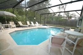 Property Photo: The large swimming pool and Jacuzzi